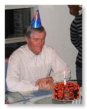 Bob looks at the cake.